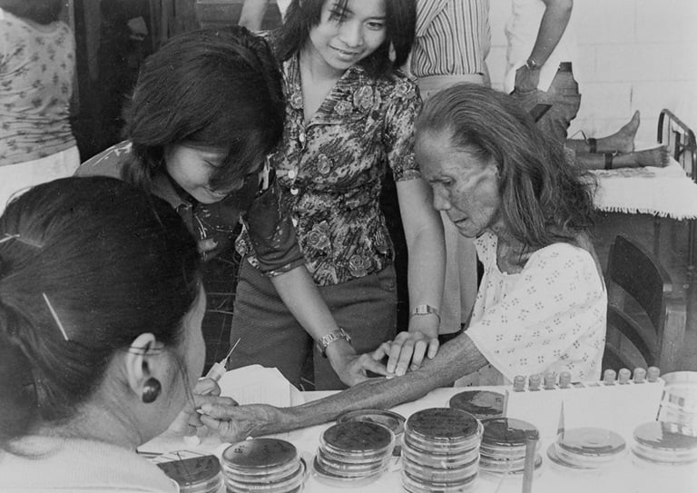 An elderly woman has her blood tested for blood sugar, uric acid, and cholesterol at the Philippine Heart Center for Asia in 1970.